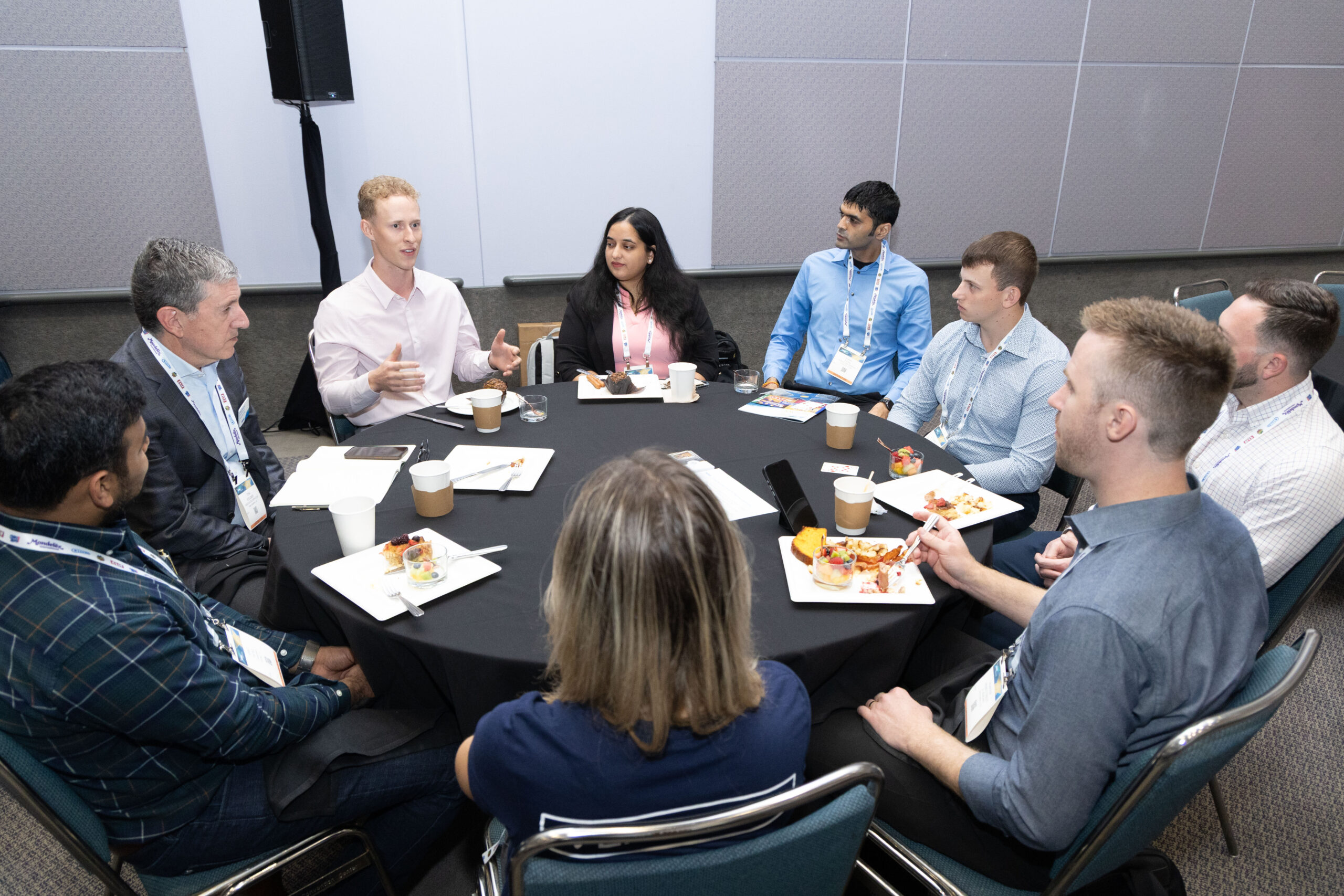 NAMA Show attendees sitting around a table networking