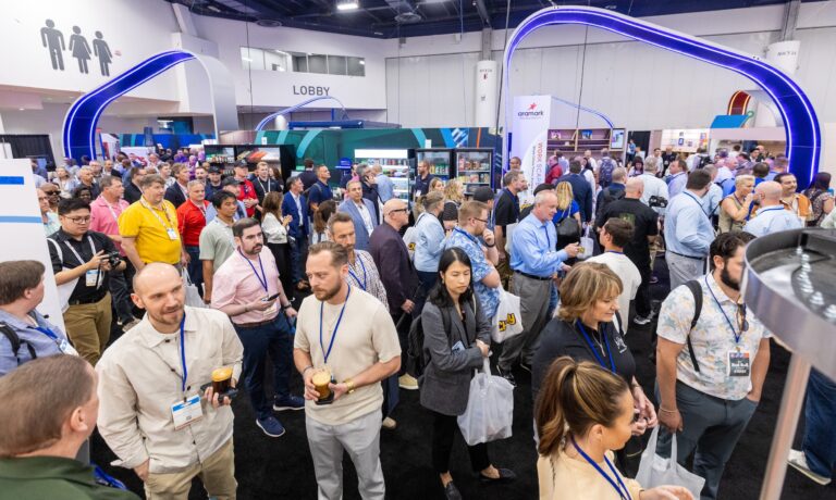 Attendees walking the NAMA Show floor
