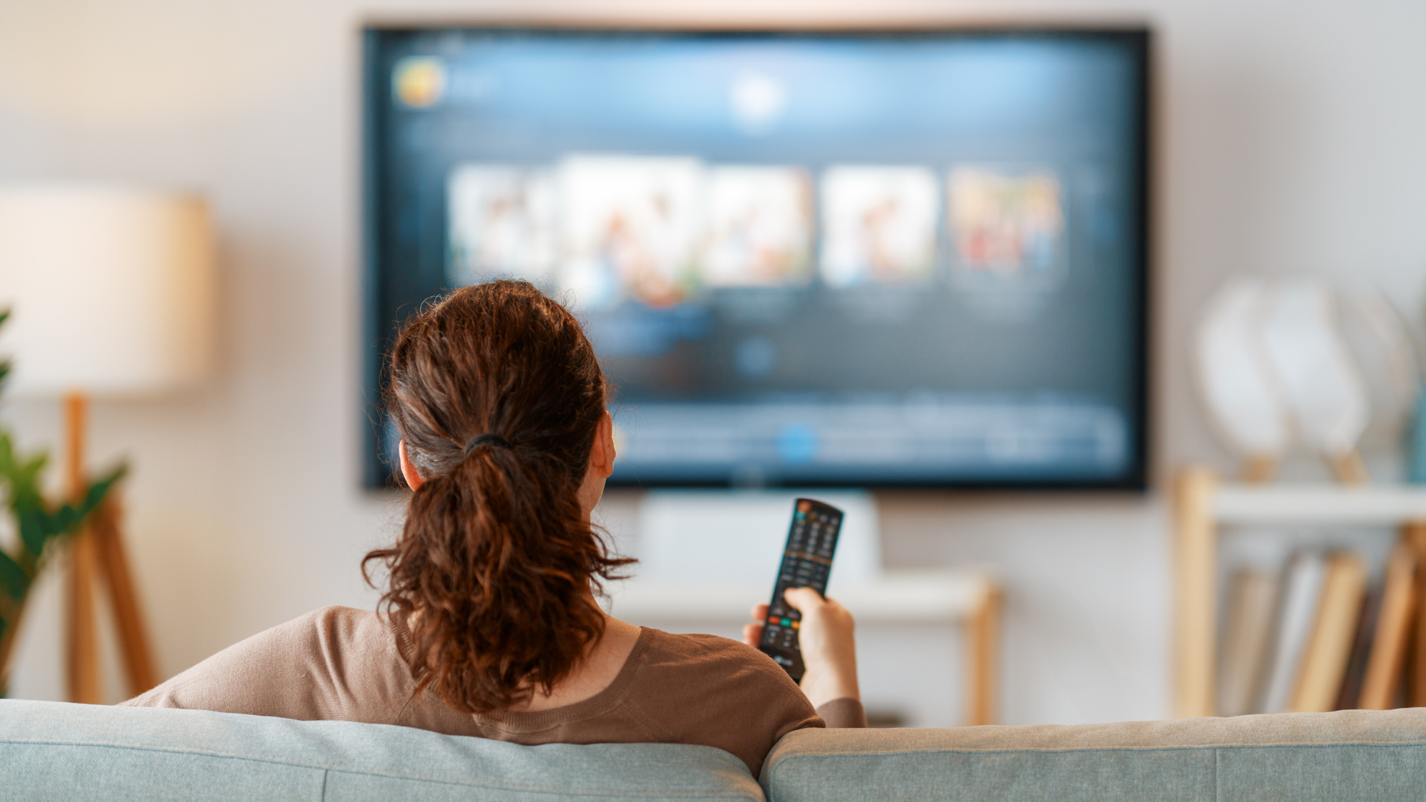 A woman exploring different streaming options.
