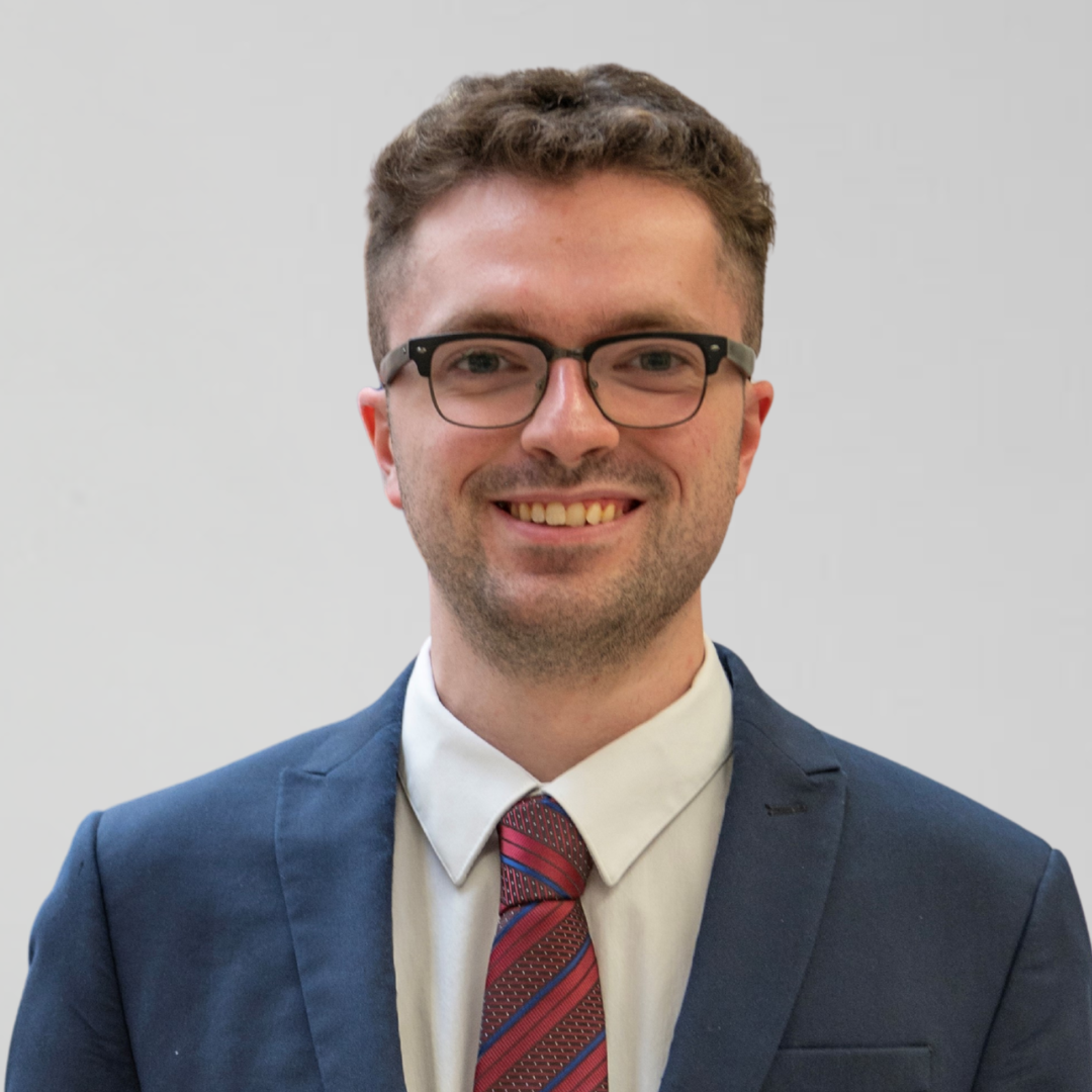 headshot of smiling male staff, Luke Rainey